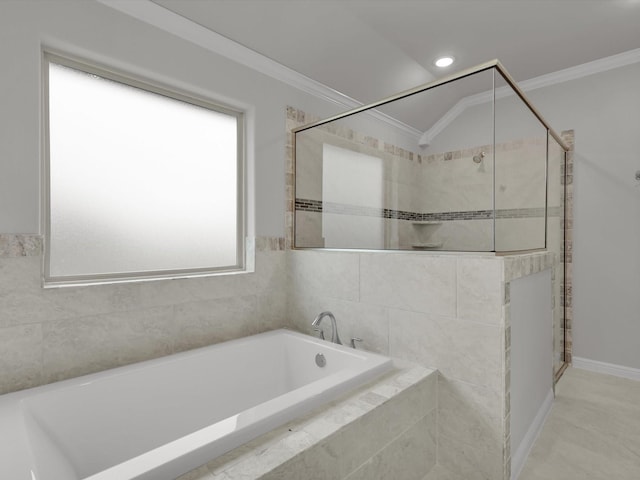 bathroom with a relaxing tiled tub, ornamental molding, vaulted ceiling, and plenty of natural light