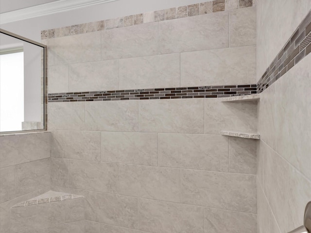 room details featuring ornamental molding and tiled shower