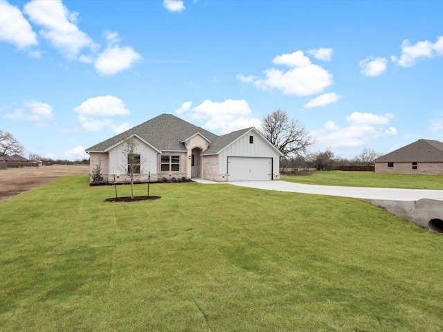 view of front of home with a garage and a front yard