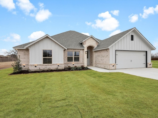 view of front of property with a garage and a front yard