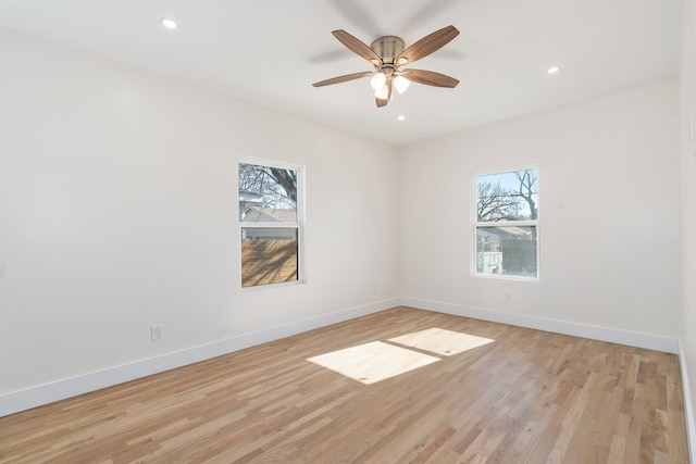 unfurnished room with light hardwood / wood-style flooring and ceiling fan