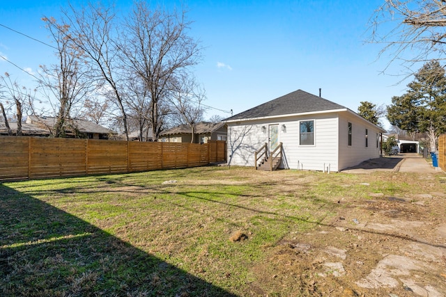 rear view of house featuring a lawn