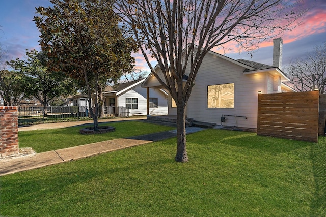 view of front of home featuring a lawn