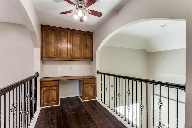 unfurnished office featuring dark hardwood / wood-style floors and ceiling fan