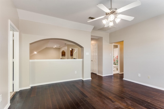 spare room with ceiling fan and dark hardwood / wood-style flooring