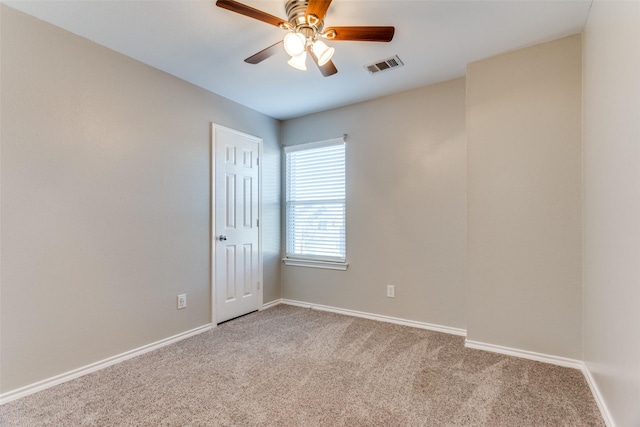 carpeted empty room with ceiling fan