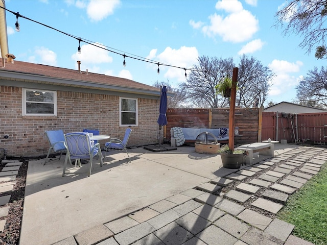 view of patio featuring an outdoor fire pit