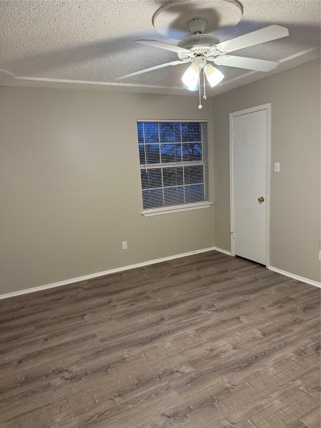 unfurnished room with ceiling fan, hardwood / wood-style flooring, and a textured ceiling