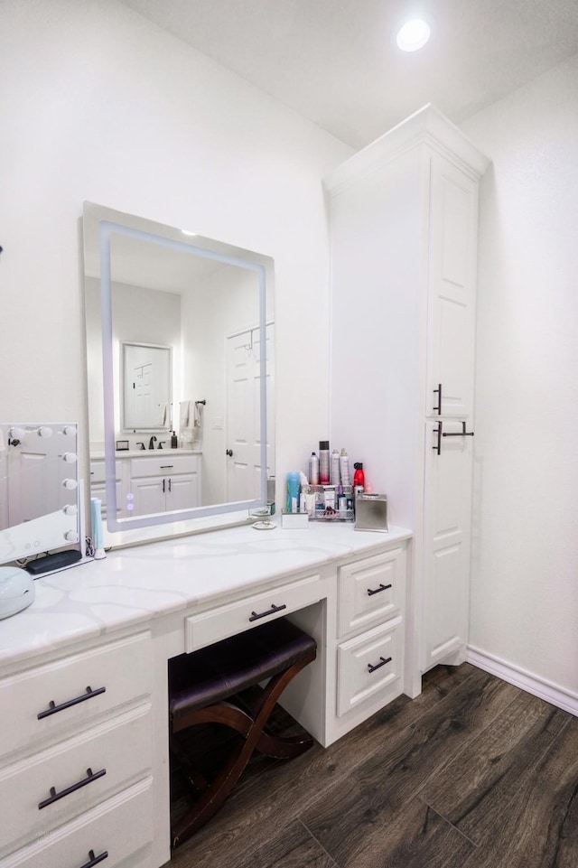 bathroom with hardwood / wood-style flooring and vanity