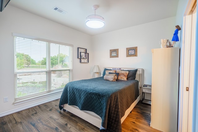 bedroom featuring dark wood-type flooring