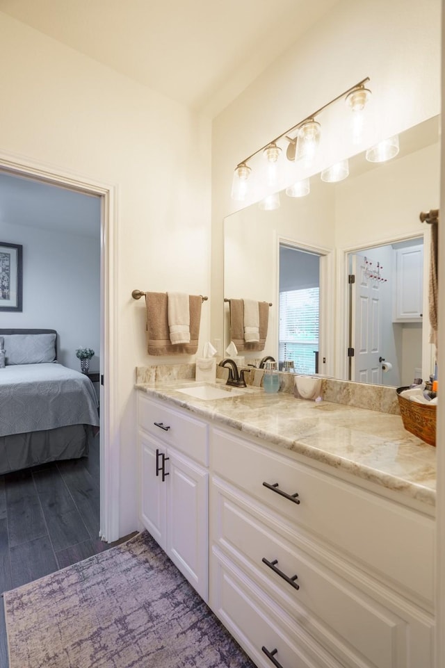 bathroom featuring vanity and hardwood / wood-style floors