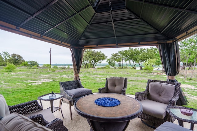 view of patio / terrace featuring a gazebo and an outdoor fire pit