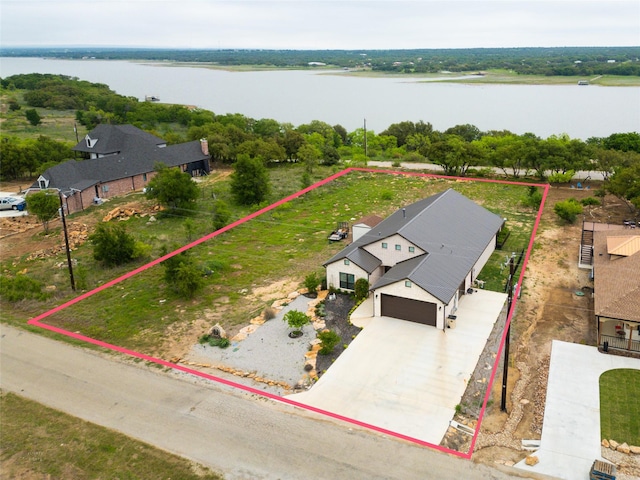 drone / aerial view with a water view