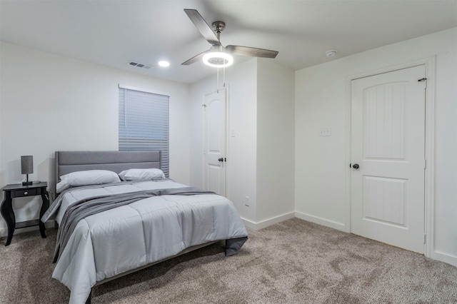 carpeted bedroom featuring ceiling fan