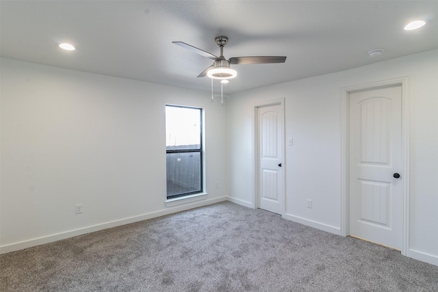 carpeted empty room with ceiling fan