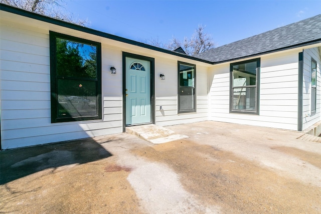 doorway to property featuring a patio area