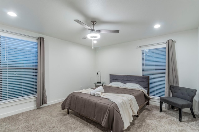 bedroom featuring ceiling fan and light colored carpet