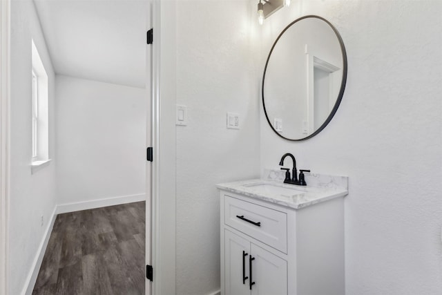 bathroom featuring vanity and hardwood / wood-style floors