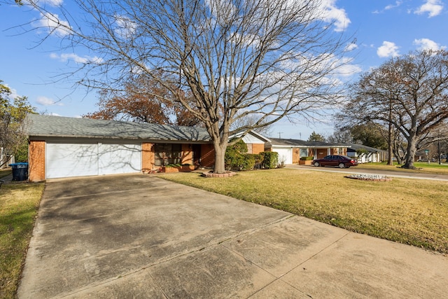 ranch-style home with a garage and a front yard