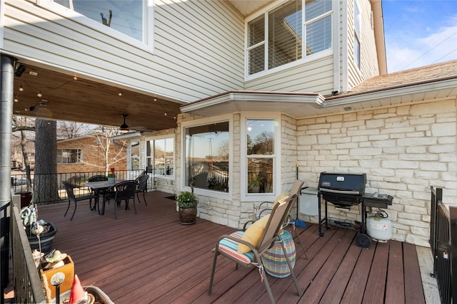 wooden terrace featuring area for grilling