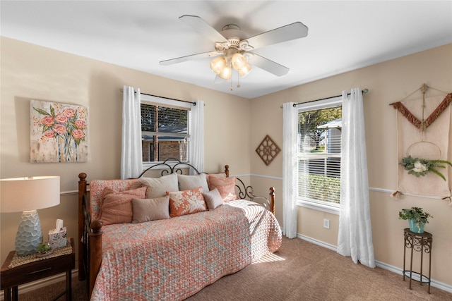 bedroom with ceiling fan and carpet