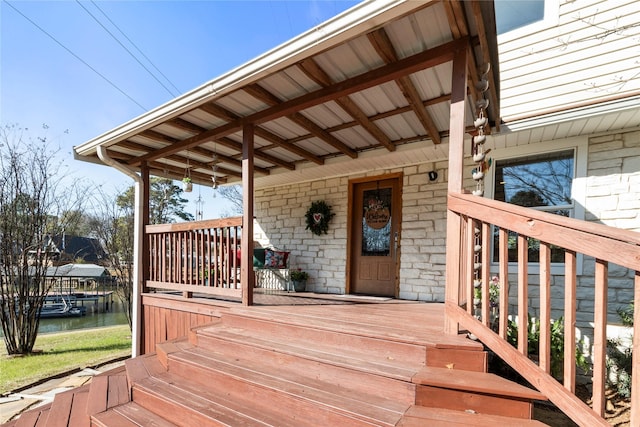 wooden deck featuring a water view