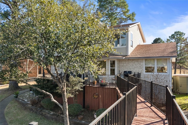 rear view of property with a deck