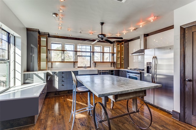 rec room featuring dark hardwood / wood-style flooring, crown molding, and ceiling fan