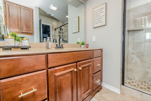 bathroom featuring vanity and a shower with shower door