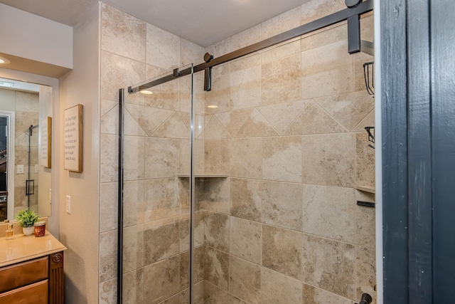 bathroom featuring vanity and a shower with shower door