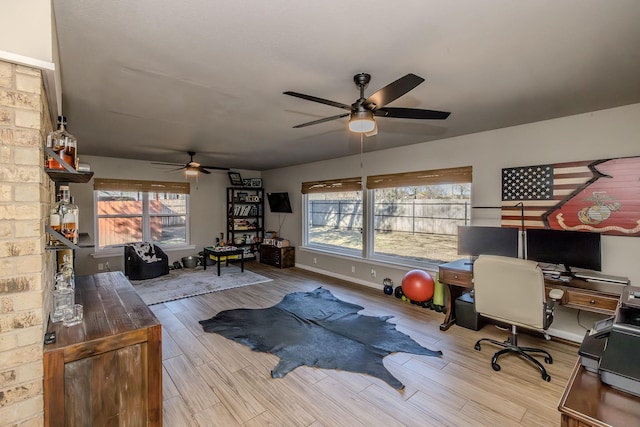 interior space featuring ceiling fan and light wood-type flooring