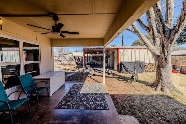 view of patio featuring ceiling fan