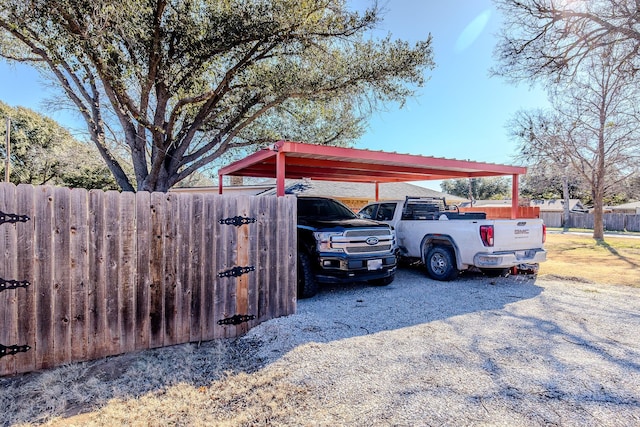 view of vehicle parking featuring a carport