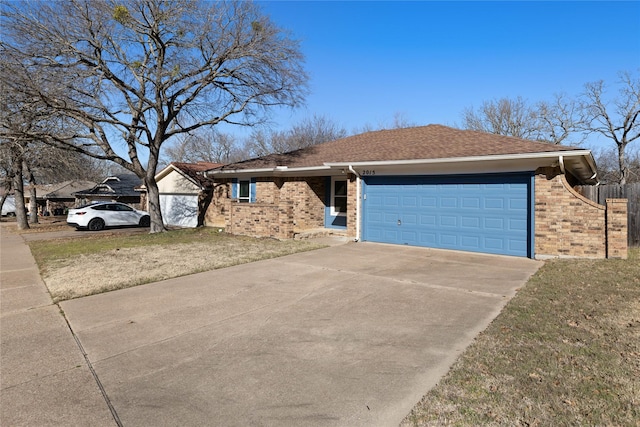 single story home featuring a garage and a front yard