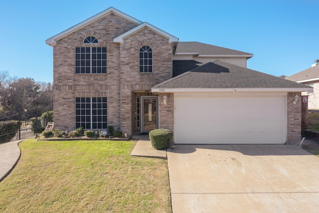 view of front of house featuring a garage and a front lawn