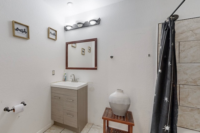 bathroom featuring tile patterned floors and vanity