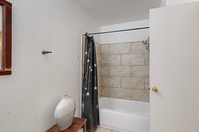 bathroom featuring shower / tub combo with curtain and tile patterned floors