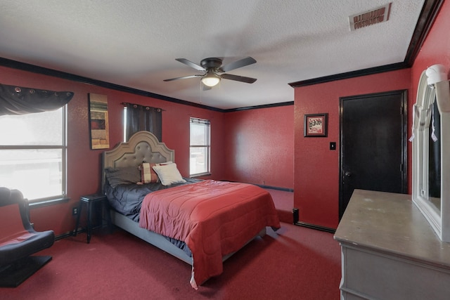 bedroom featuring crown molding, a textured ceiling, ceiling fan, and carpet flooring