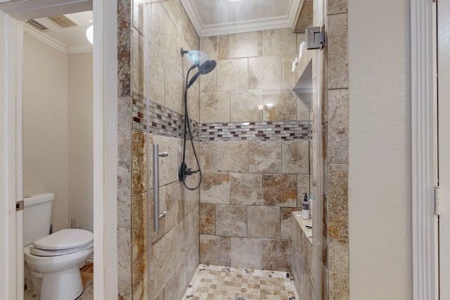 bathroom featuring ornamental molding, a shower with shower door, and toilet