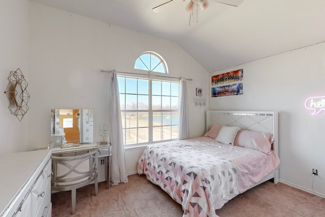 bedroom with vaulted ceiling, light carpet, and ceiling fan