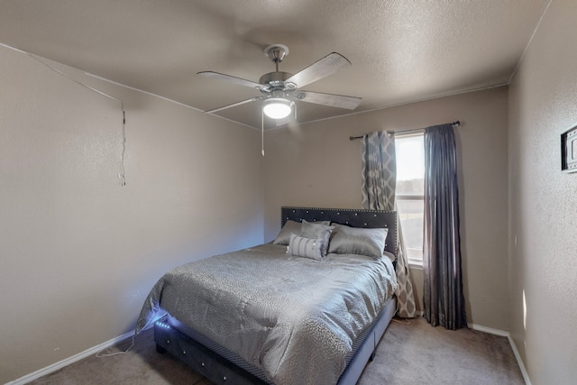 bedroom with light carpet, a textured ceiling, and ceiling fan