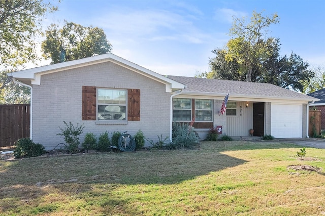 single story home featuring a garage and a front lawn