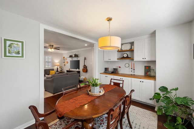 dining room with ceiling fan and light wood-type flooring