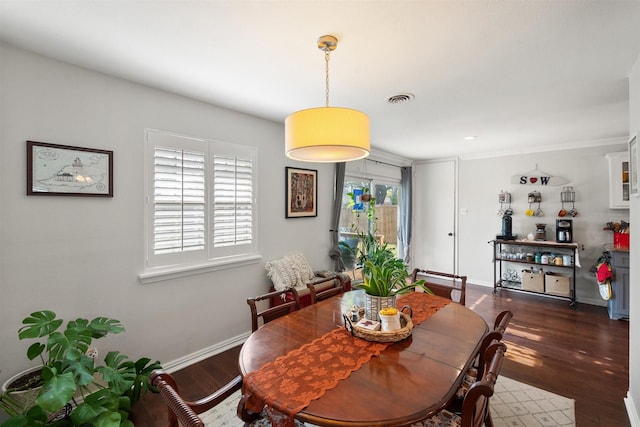 dining room with dark hardwood / wood-style flooring