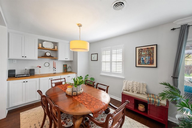 dining space featuring dark hardwood / wood-style flooring