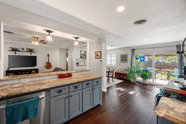 kitchen featuring crown molding, gray cabinets, dark wood-type flooring, and light stone counters