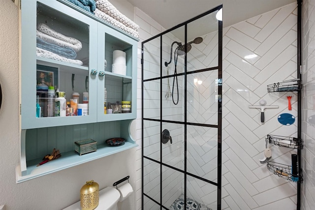 bathroom with a tile shower