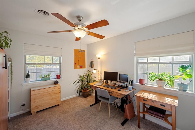 carpeted home office with ceiling fan