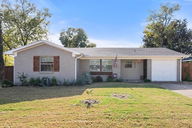 single story home featuring a garage and a front yard