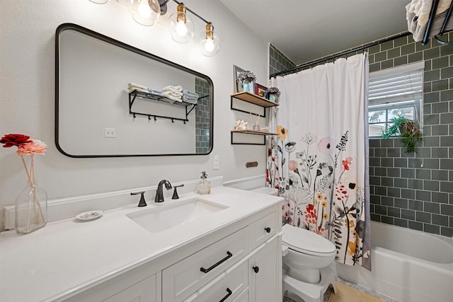 full bathroom featuring vanity, shower / bath combination with curtain, and toilet